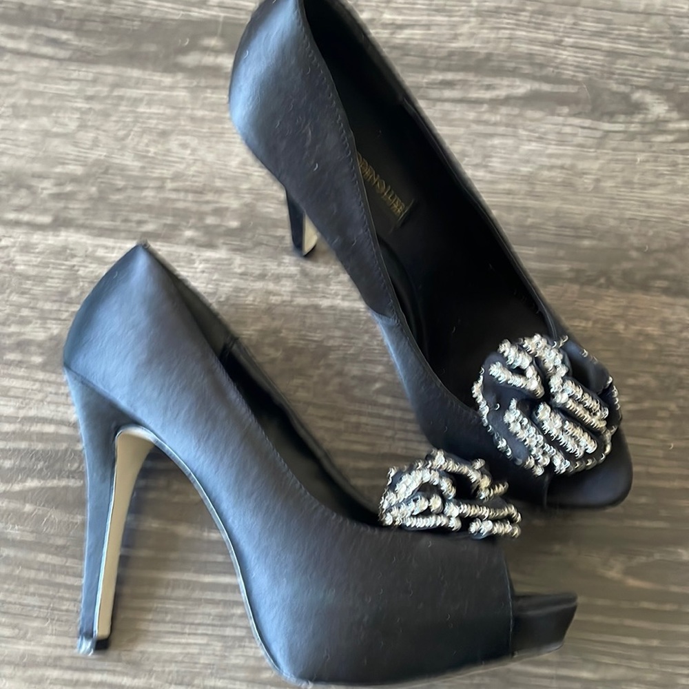 Black satin platform pumps